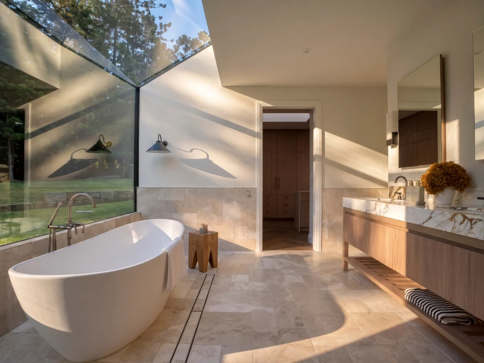 Stone flooring, timber vanity and bathroom fittings in an Eastern Built project